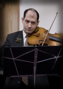 Ed plays violin along with the harp for entry of wedding party.
